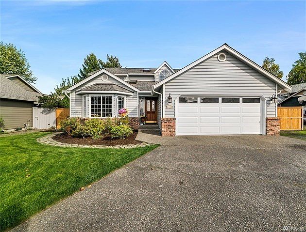 Lovely 4 bedroom home, beautifully landscaped in cul-de-sac setting with green belt behind.  Bay window and brick accents add charm. Large driveway offers plenty of parking. This beauty has a heat pump too!