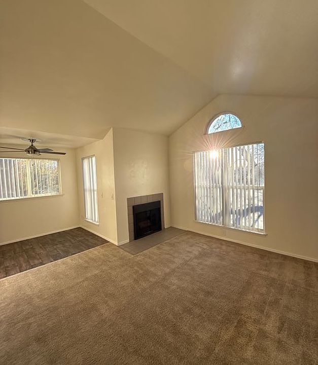 Third floor with vaulted ceilings and fireplace.