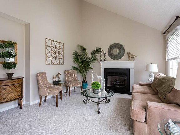 vaulted ceiling with a skylight to enhance brightness and sp