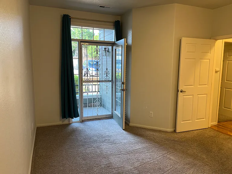 Master bedroom additional photo showing entry door.