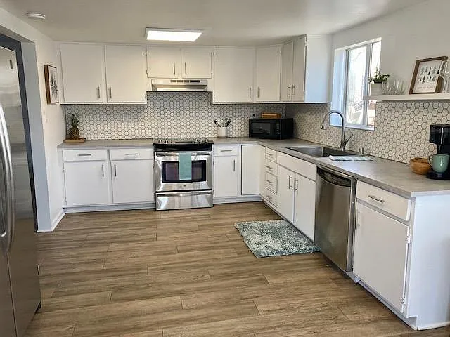 Spacious, recently renovated kitchen with stainless steel appliances. Fully stocked with kitchen essentials.