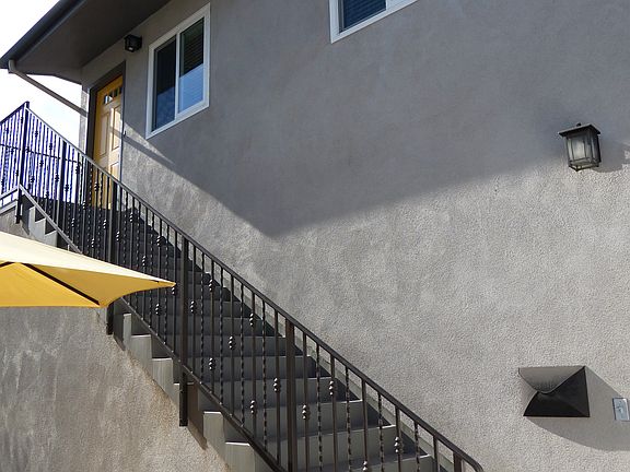 Staircase to the upstairs apartment.