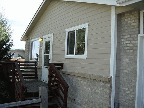 Front of home from driveway to two-car garage.