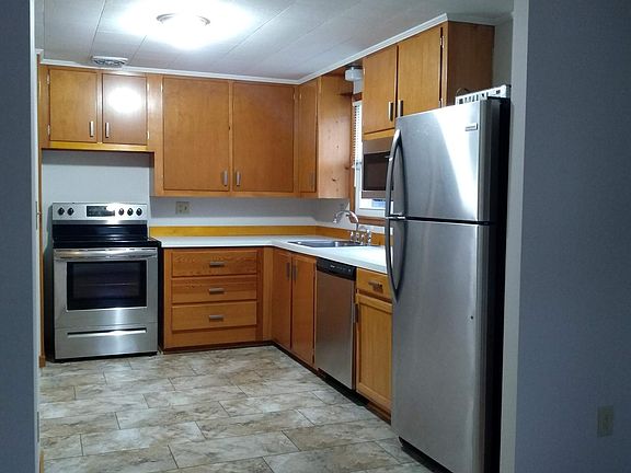Kitchen with new floor and appliances.