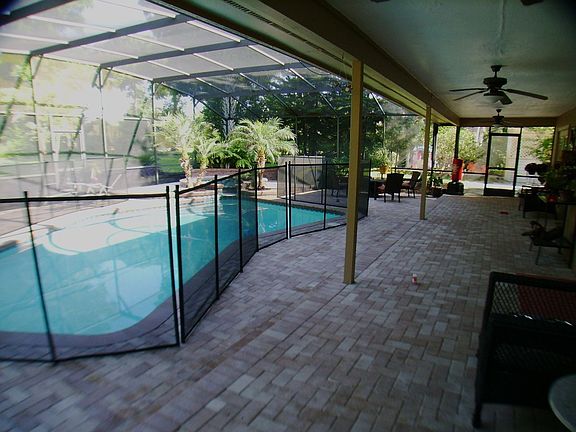 1500 sq. ft. newly pavered screened in pool area.