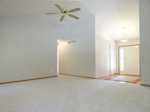 This gracious entrance is nicely open and invites one into the 17' by 17' great room with soaring vaulted ceilings, lending a greater feeling of space not to mention added character!