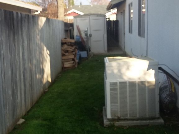 side yard with storage shed