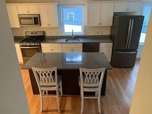Kitchen view of sink and cabinets