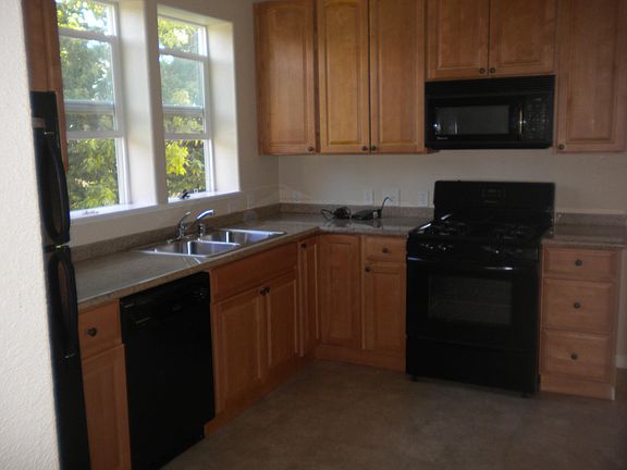 Large kitchen, lots of cabinet space, built in microwave.
