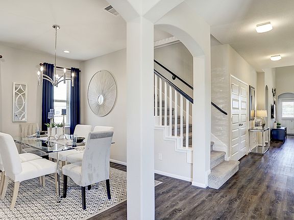 Dining room tucked off foyer