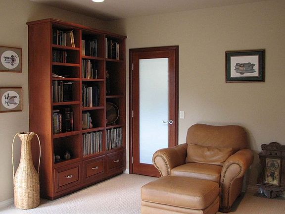 A large office is next to the master bedroom. It has deck access & forest view