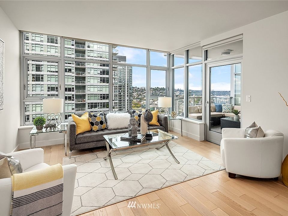 Living room with walls of windows to showcase the views.