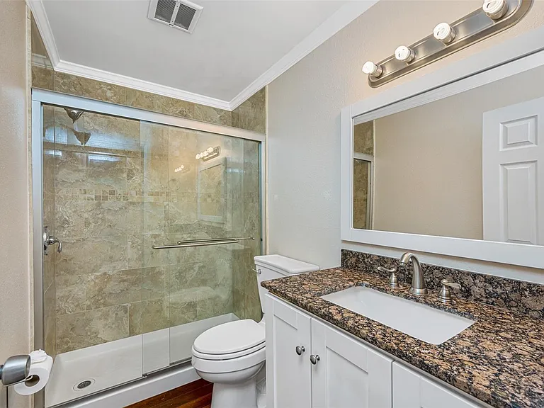 2nd bathroom with a glass door closure