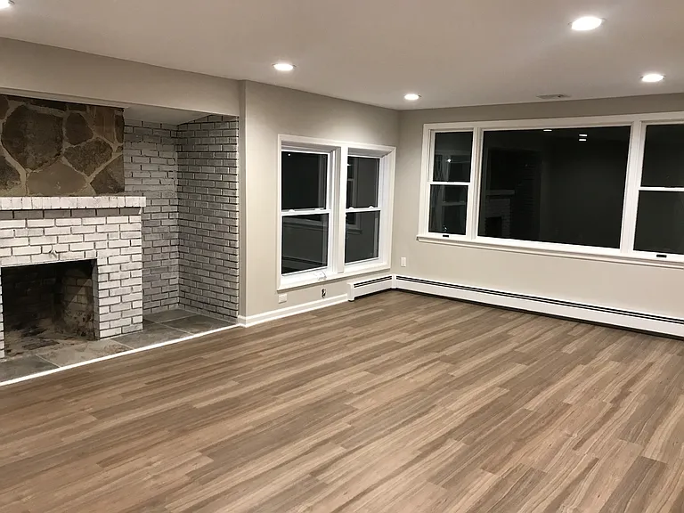 Living Room with Lake Views and Decorative Fireplace