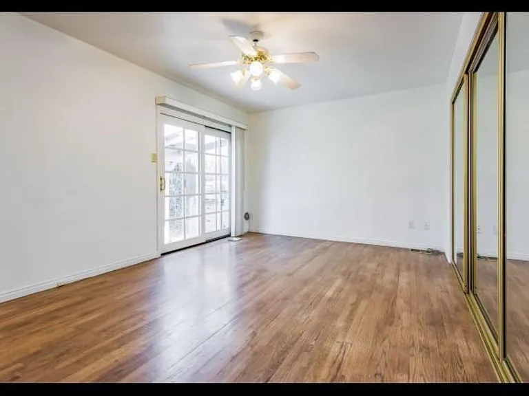 Upstairs larger bedroom - mirrors are all closets which have built ins inside