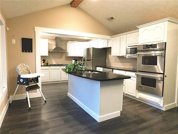 Spacious open kitchen offers plenty of storage