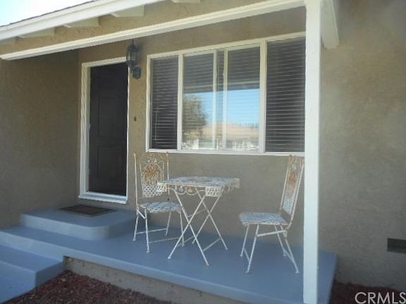 freshly painted porch with newer dual pane windows.