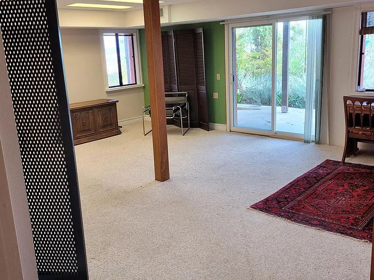 Large East facing main room facing gardens.
