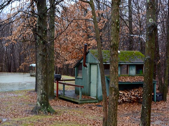 Rustic cabin at stocked pond