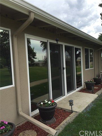 Lots of windows and doors to view the beautiful greenbelt