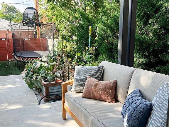 Backyard that leads straight to the 2 large detached garage, fenced in back yard