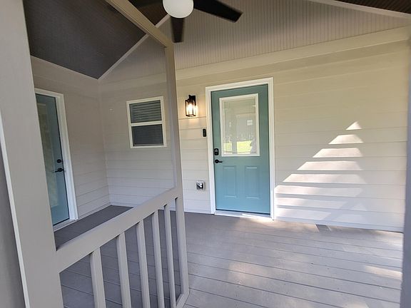 Screened-in porch -- door to office on left and door to kitchen on right.