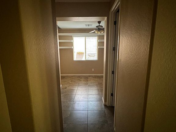 Entry left towards den, bedrooms, and guest bath.