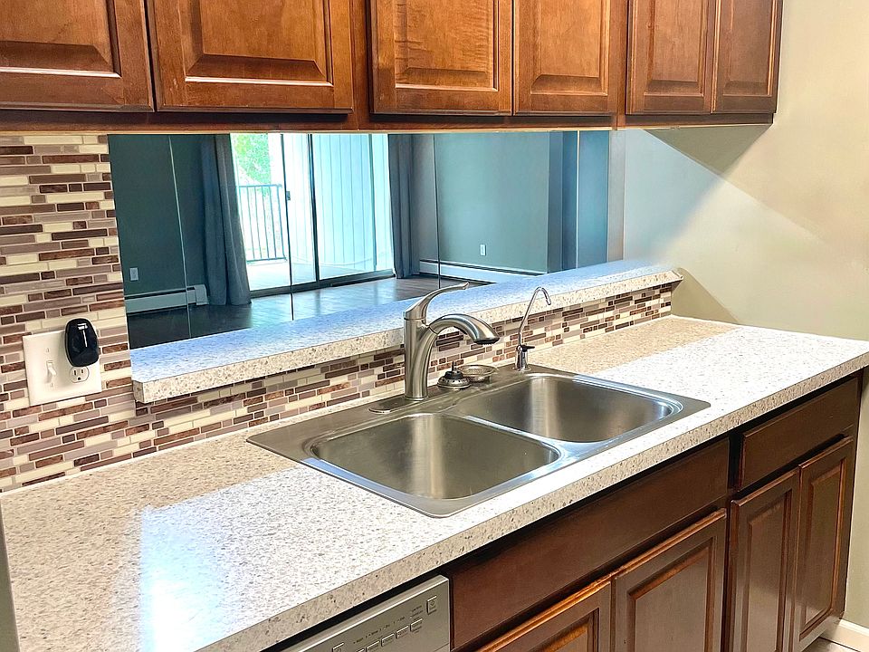 Kitchen has high quality cabinets, a pass through window to counter for bar height stools.