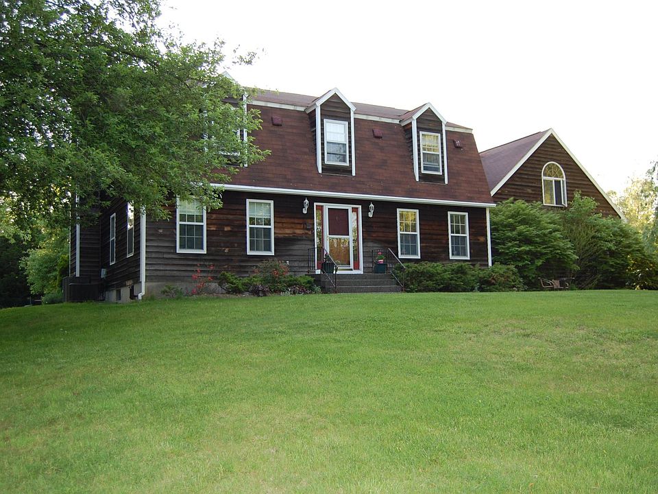 Front view: 1 x 8 cedar siding, 5/4 vinyl trim. Low maintena