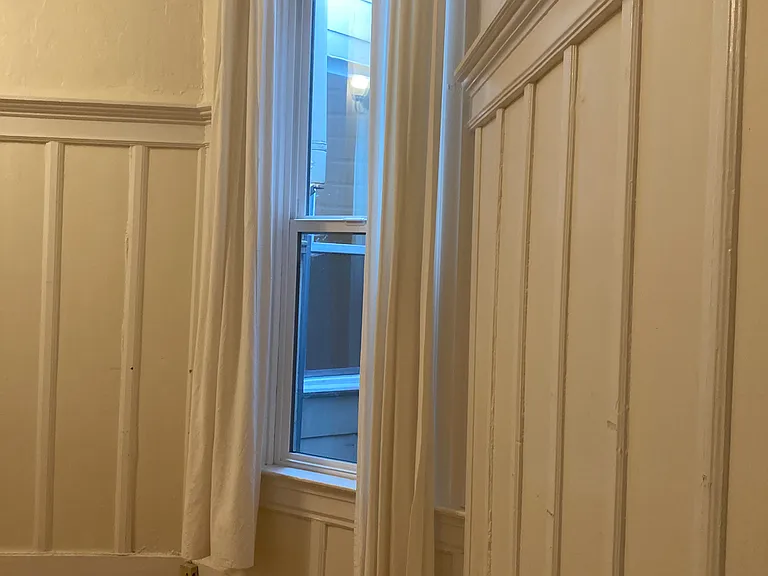 Bedroom window from closet corner