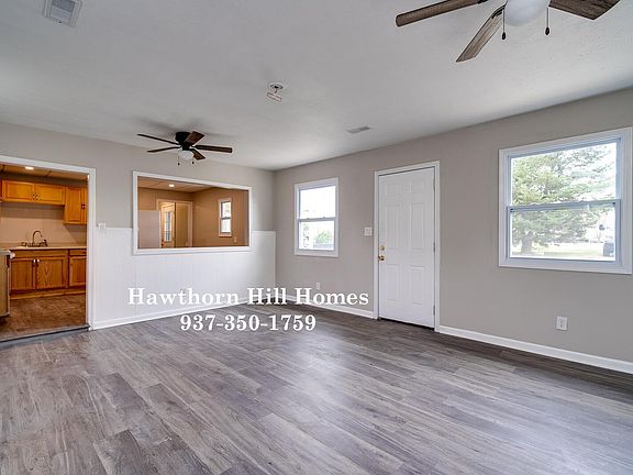 Living Room looking into eat in Kitchen