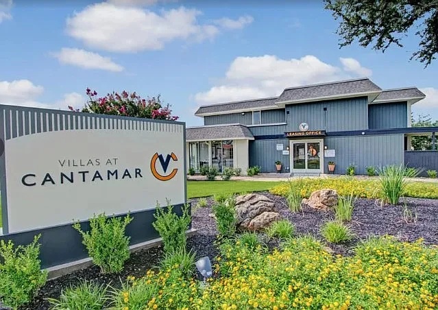Community monument sign and landscaped entrance