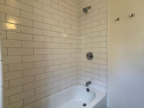 Updated bathroom with residential grade glass shower (glass shower door not shown)