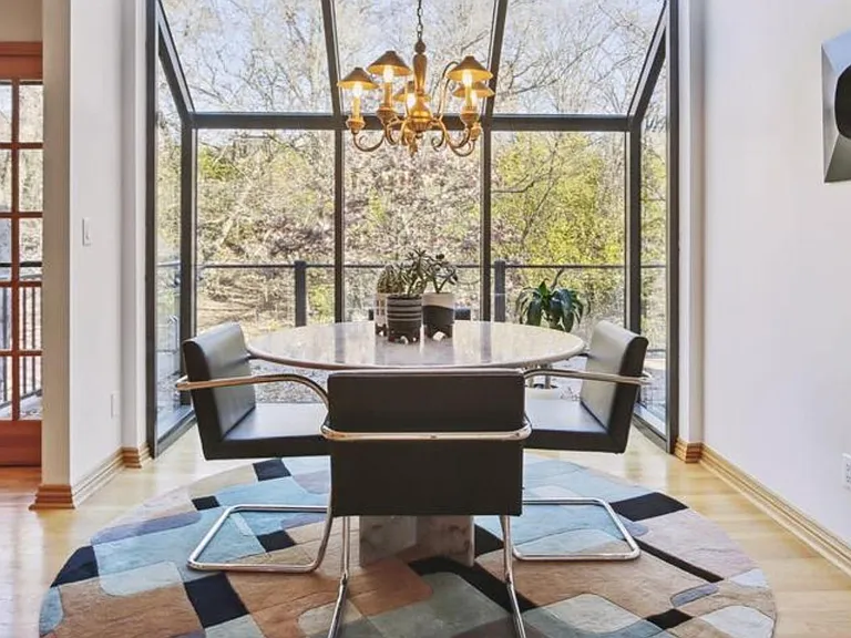 Sunning dinette atrium with private oasis views