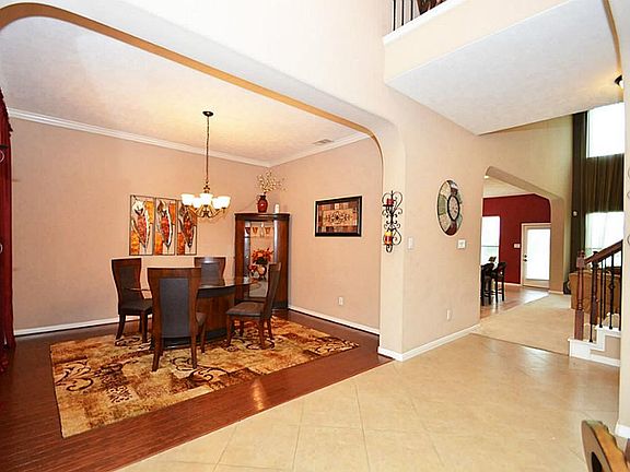 Enchanting entrance with tiled floors.  To the left is formal dining room and on the right is the study.