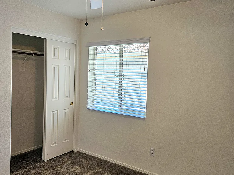 Third bedroom with ceiling fan