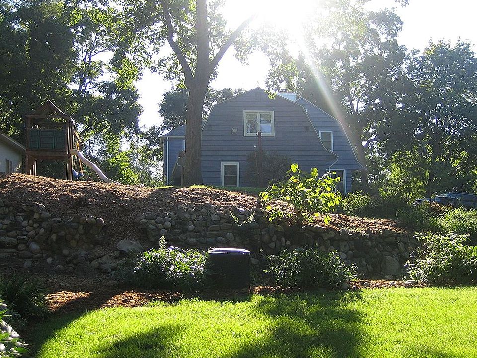 view of west end of house from lowest tier of the yard