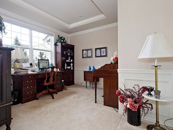 Den/Office with coffered ceiling and wainscoting.