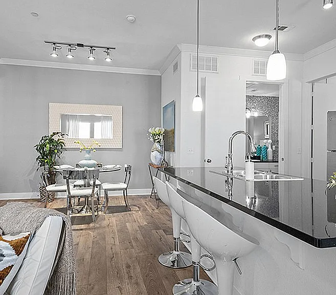 Experience luxury living with this sleek kitchen and dining space. Experience luxury living with this sleek kitchen and dining space.