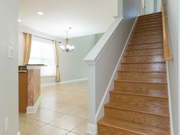 Stairs finished in oak hardwood leading to upstairs loft / study