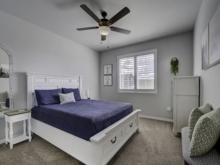 Queen Bedroom
Upstairs bedroom with queen bed, dresser, full-length mirror, and walk-in closet