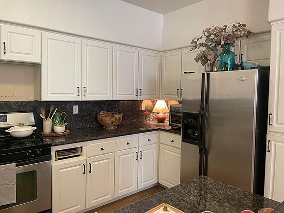 Ample kitchen counter space and storage and full size refrigerator.