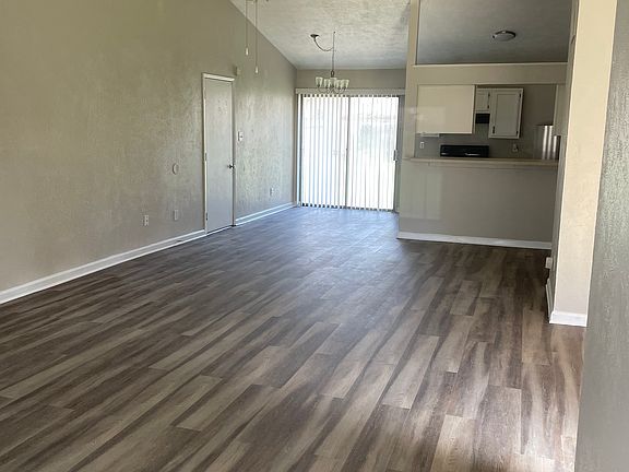 Living room & breakfast table area along with sliding door to back yard