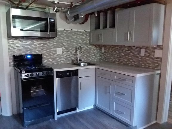 Stocked with dishes, coffee maker, mixer, cooking items, etc.