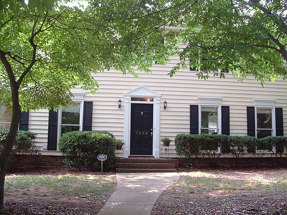 Front of home, complimented with mature trees