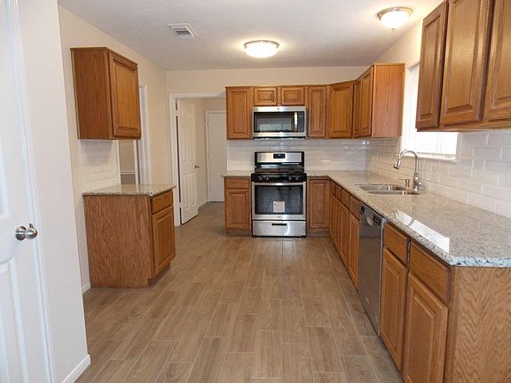 Huge kitchen with plenty of counter space to enjoy cooking m