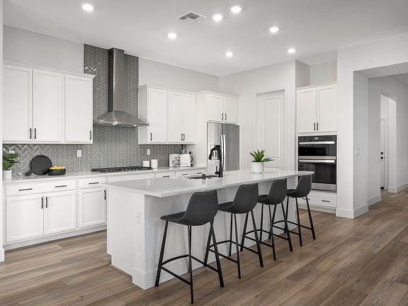 Spacious, island kitchen with eat-in bartop and abundant cabinet space