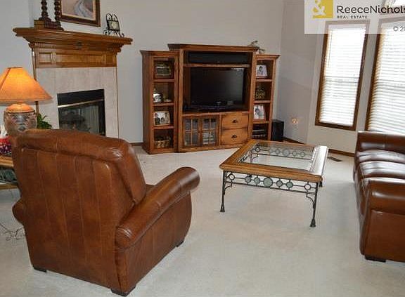 Spacious living room, with fireplace.