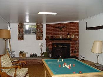 Finished basement with another fireplace and a new hot water boiler for heat.