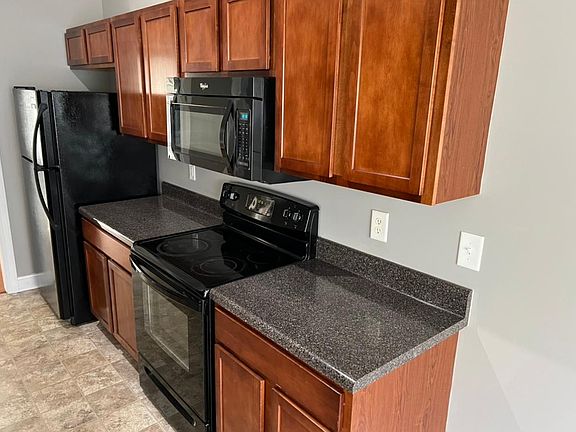 Kitchen, stove, fridge, & cabinets